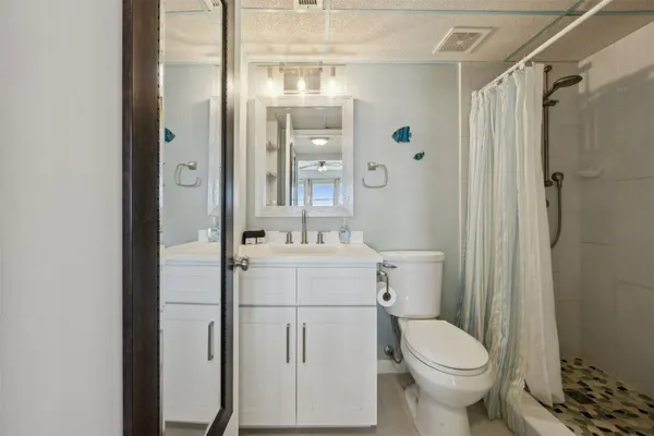 a bedroom with a bed and a table