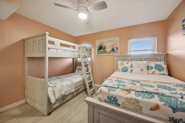 a bedroom with a bed and flat screen tv