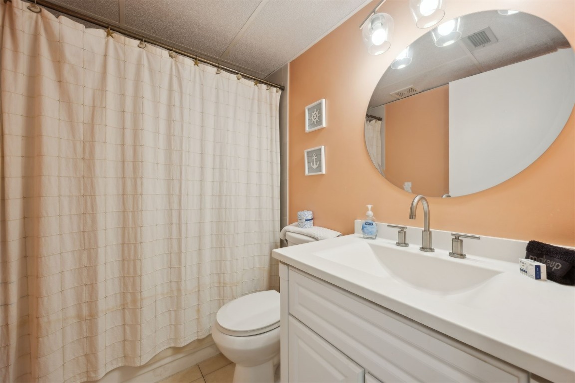 3350 South Fletcher Avenue, Unit 5D Fernandina Beach, FL 32034 - Photo 23 of 48 a bathroom with a sink and a mirror