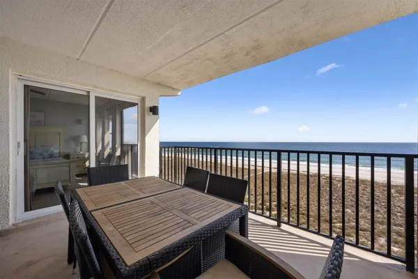 a view of a balcony dining area