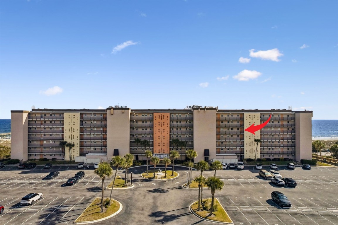 3350 South Fletcher Avenue, Unit 5D Fernandina Beach, FL 32034 - Photo 30 of 48 a building with swimming pool and outdoor seating