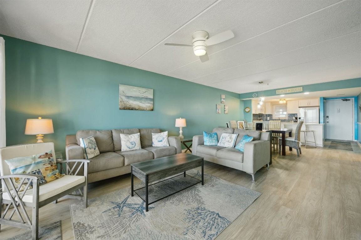 3350 South Fletcher Avenue, Unit 5D Fernandina Beach, FL 32034 - Photo 4 of 48 a living room with furniture and wooden floor