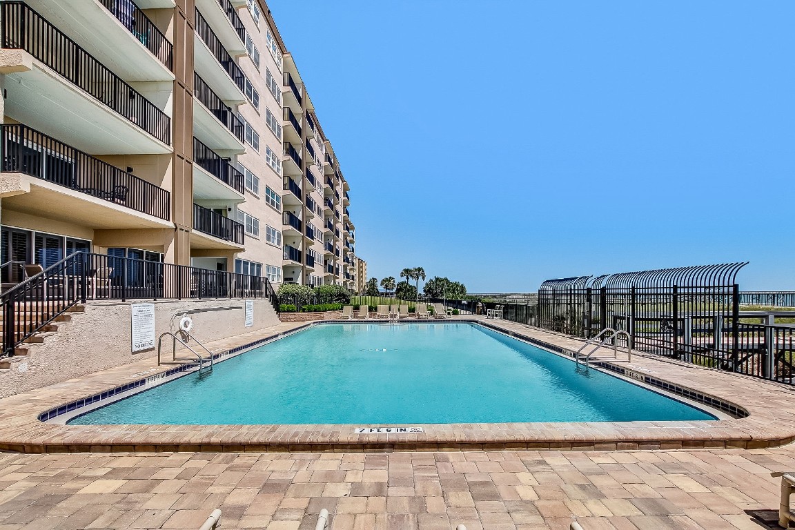 3350 South Fletcher Avenue, Unit 5D Fernandina Beach, FL 32034 - Photo 41 of 48 a view of swimming pool with outdoor seating and city view
