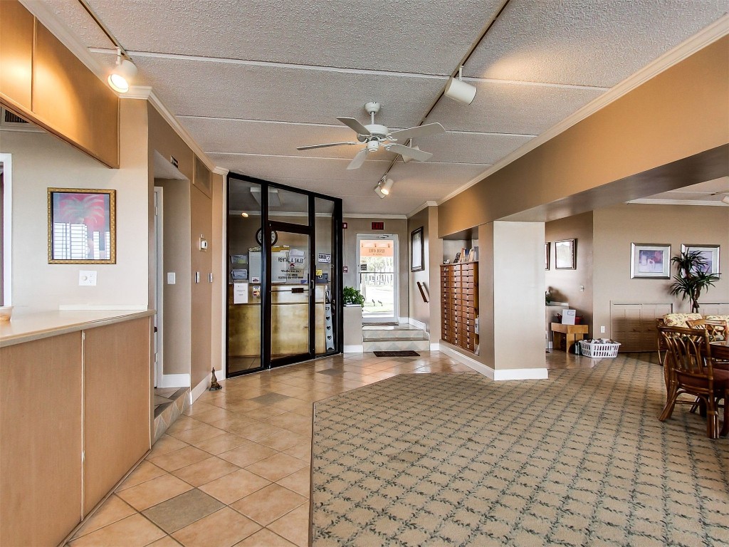 3350 South Fletcher Avenue, Unit 5D Fernandina Beach, FL 32034 - Photo 45 of 48 a view of a livingroom with furniture a ceiling fan and window