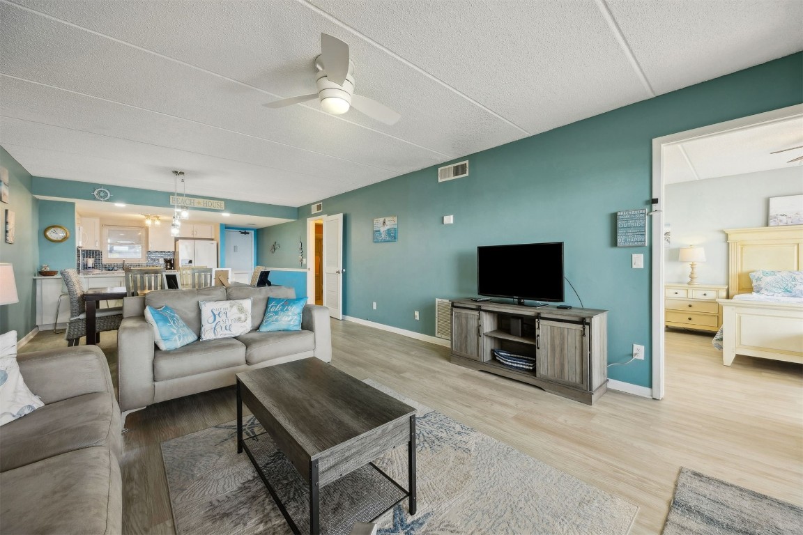 3350 South Fletcher Avenue, Unit 5D Fernandina Beach, FL 32034 - Photo 5 of 48 a living room with furniture and a flat screen tv