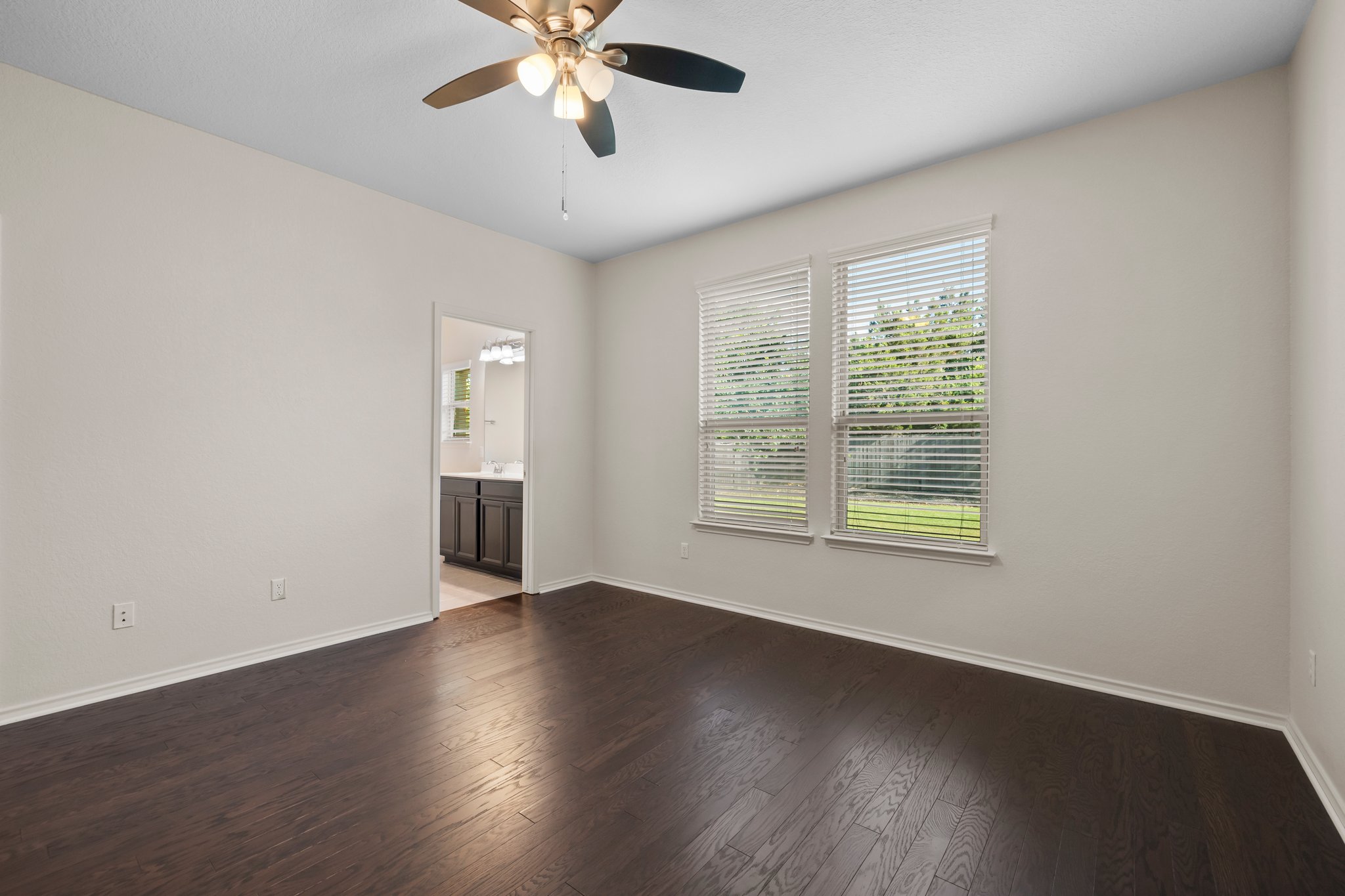 537 Bonnet Boulevard Georgetown, TX 78628 - Photo 14 of 25 Primary suite overlooks the backyard.