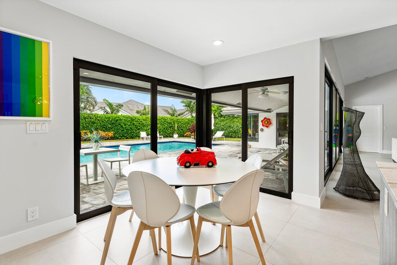 3707 Red Maple Circle Delray Beach, FL 33445 - Photo 18 of 39 a outdoor space with furniture and a garden