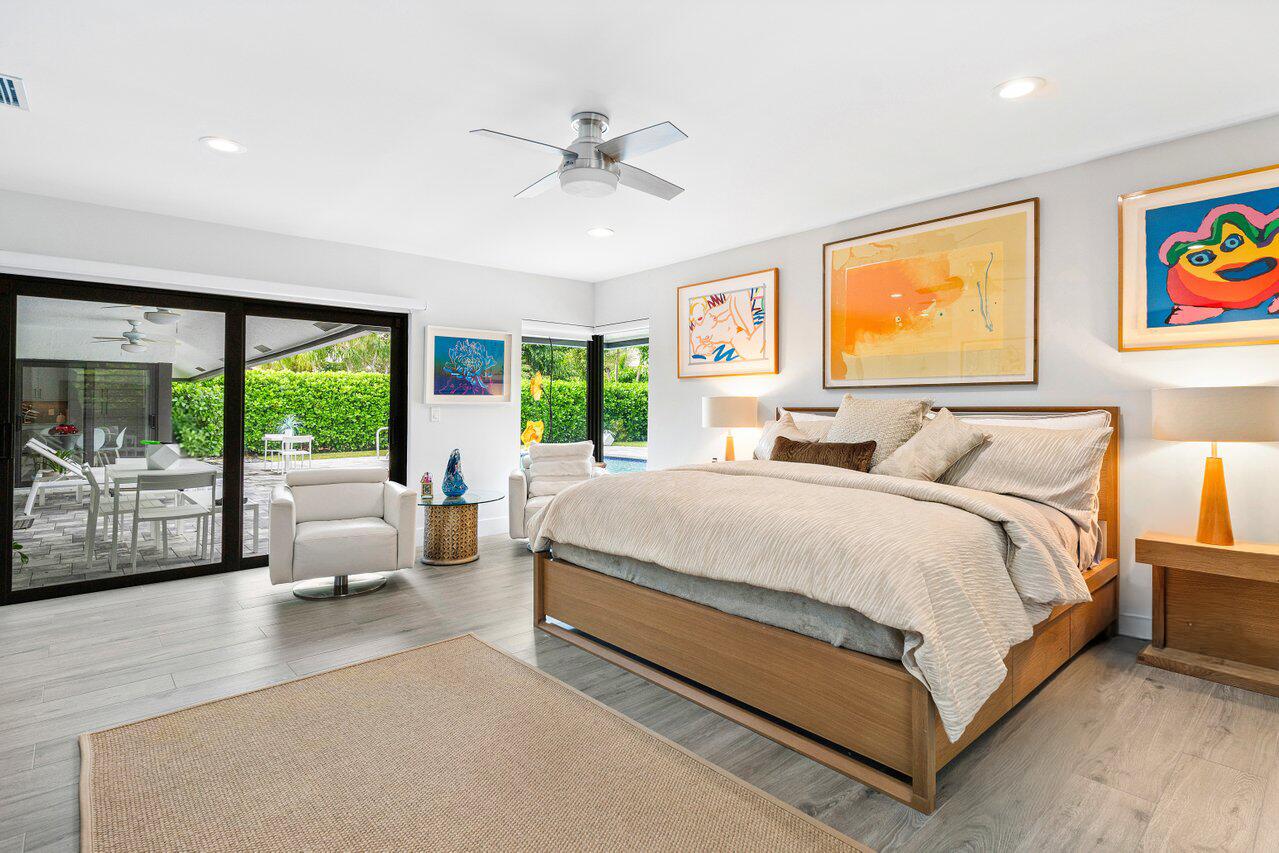 3707 Red Maple Circle Delray Beach, FL 33445 - Photo 21 of 39 a bed room with large bed and a large window