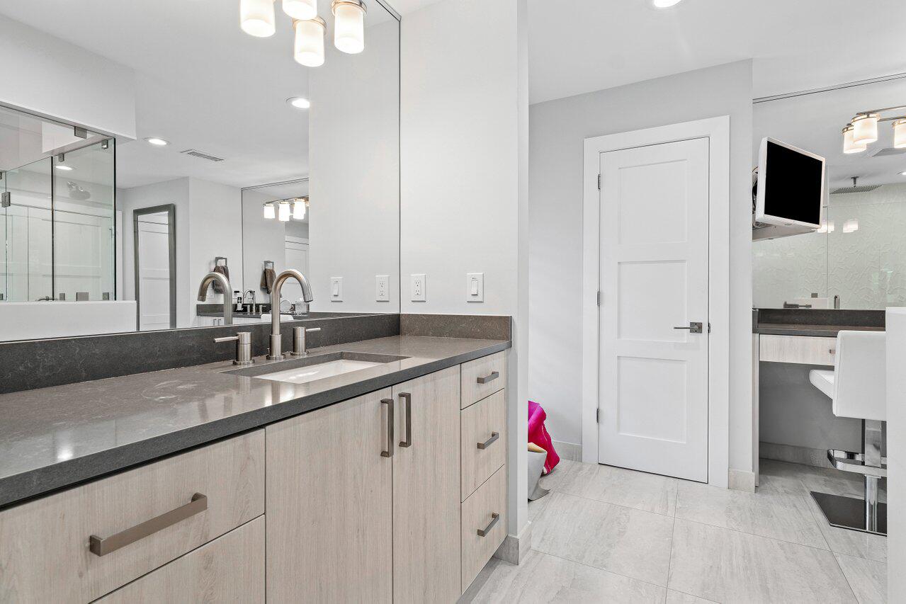 3707 Red Maple Circle Delray Beach, FL 33445 - Photo 24 of 39 a bathroom with a sink and a mirror