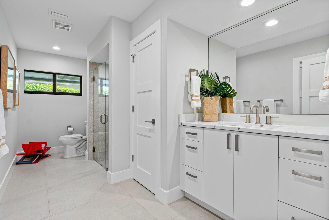 3707 Red Maple Circle Delray Beach, FL 33445 - Photo 26 of 39 a bathroom with a sink and a mirror