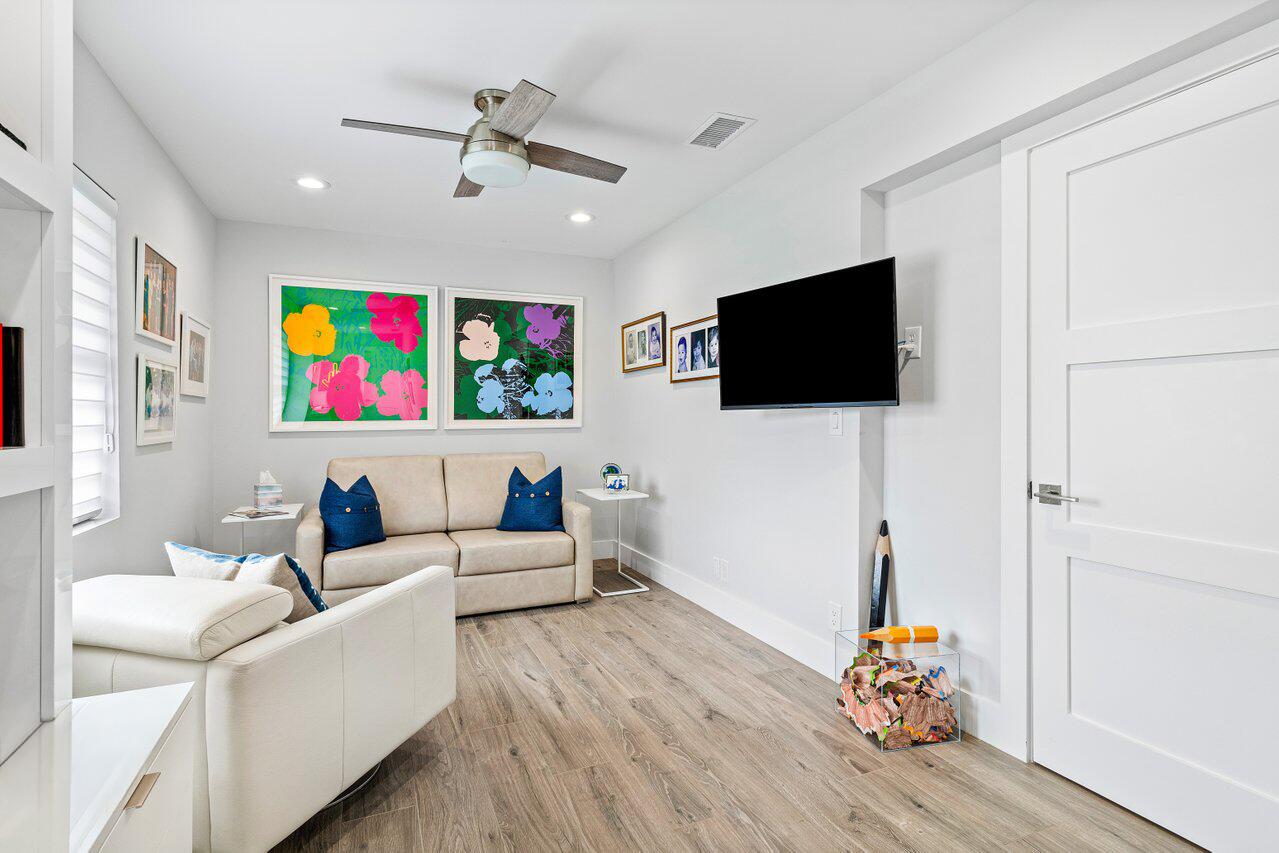 3707 Red Maple Circle Delray Beach, FL 33445 - Photo 28 of 39 a living room with furniture and a flat screen tv