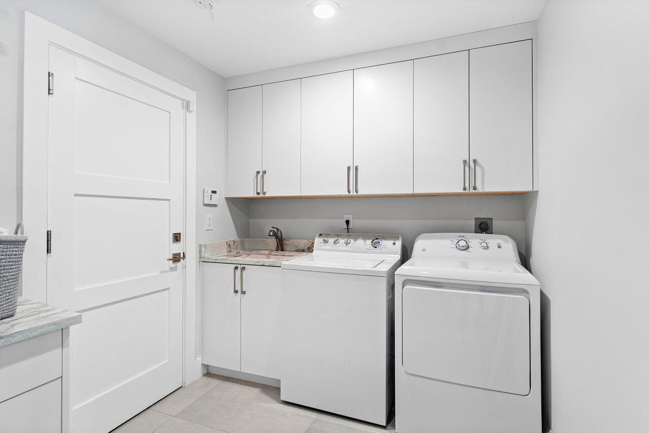 3707 Red Maple Circle Delray Beach, FL 33445 - Photo 29 of 39 a view of storage and utility room with washer and dryer