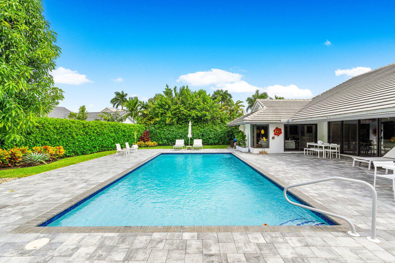 3707 Red Maple Circle Delray Beach, FL 33445 - Photo 31 of 39 a view of a backyard with swimming pool