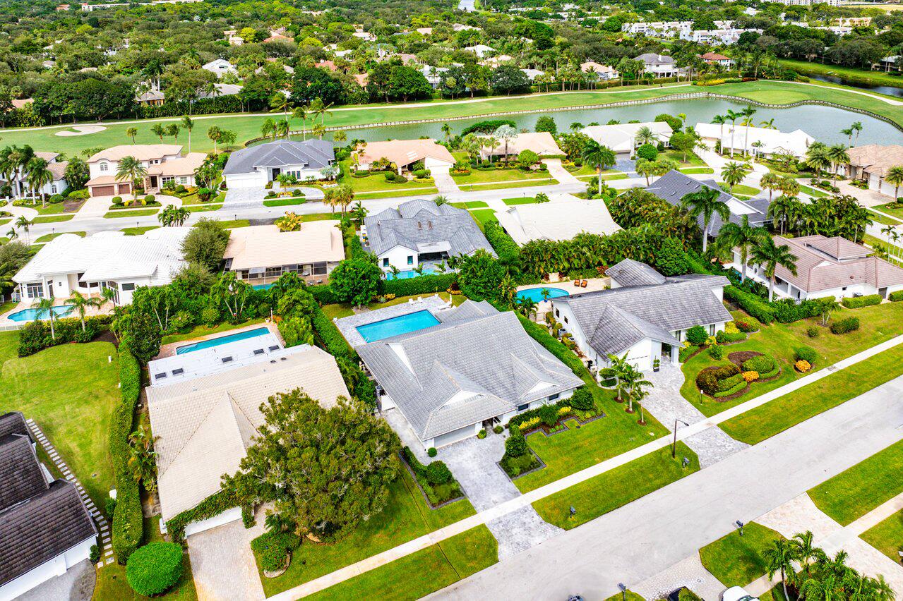 3707 Red Maple Circle Delray Beach, FL 33445 - Photo 36 of 39 an aerial view of a house with a garden and lake view