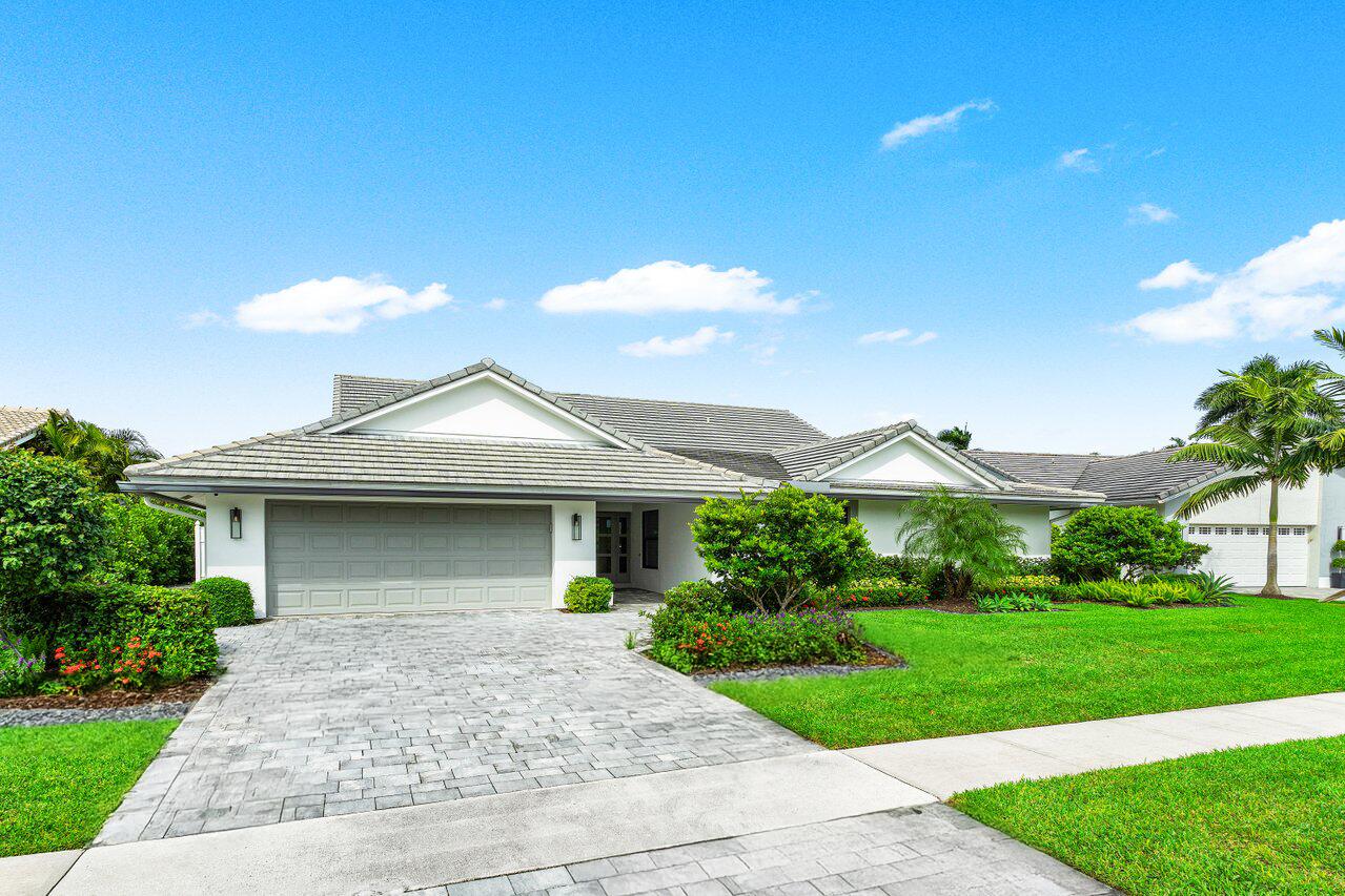 3707 Red Maple Circle Delray Beach, FL 33445 - Photo 5 of 39 a front view of a house with a yard