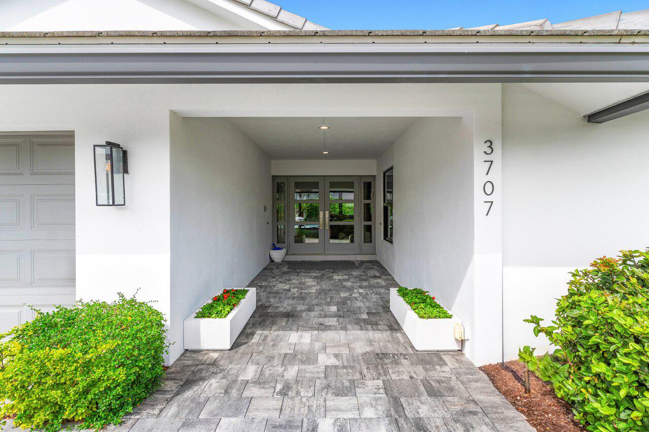 3707 Red Maple Circle Delray Beach, FL 33445 - Photo 6 of 39 a view of a back yard of the house