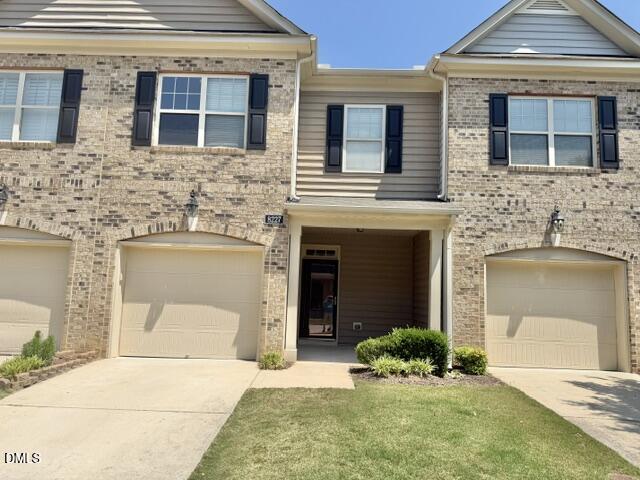 8227 Primanti Boulevard Raleigh, NC 27612 - Photo 25 of 25 a front view of a house with a yard and garage