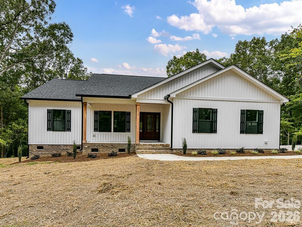 6720 Jesse Rushing Road Marshville, NC 28103 - Photo 2 of 28 a front view of a house with a yard