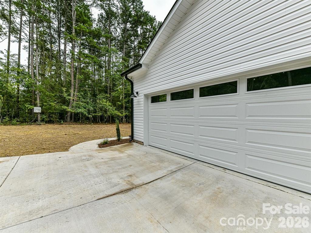 6720 Jesse Rushing Road Marshville, NC 28103 - Photo 24 of 28 a view of a house with a backyard