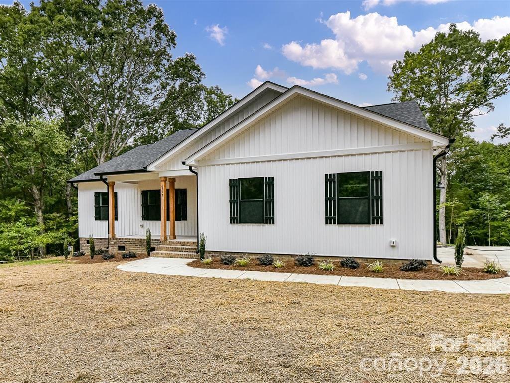 6720 Jesse Rushing Road Marshville, NC 28103 - Photo 3 of 28 a view of house with yard