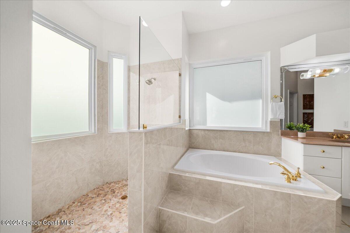 4329 Collingtree Drive Rockledge, FL 32955 - Photo 17 of 36 a bathroom with a bathtub and a shower