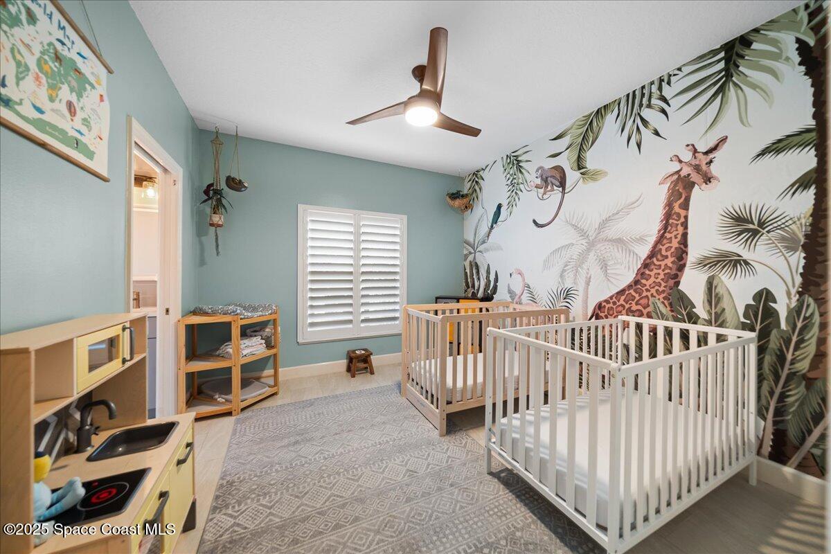 4329 Collingtree Drive Rockledge, FL 32955 - Photo 18 of 36 a view of a bedroom with furniture and windows