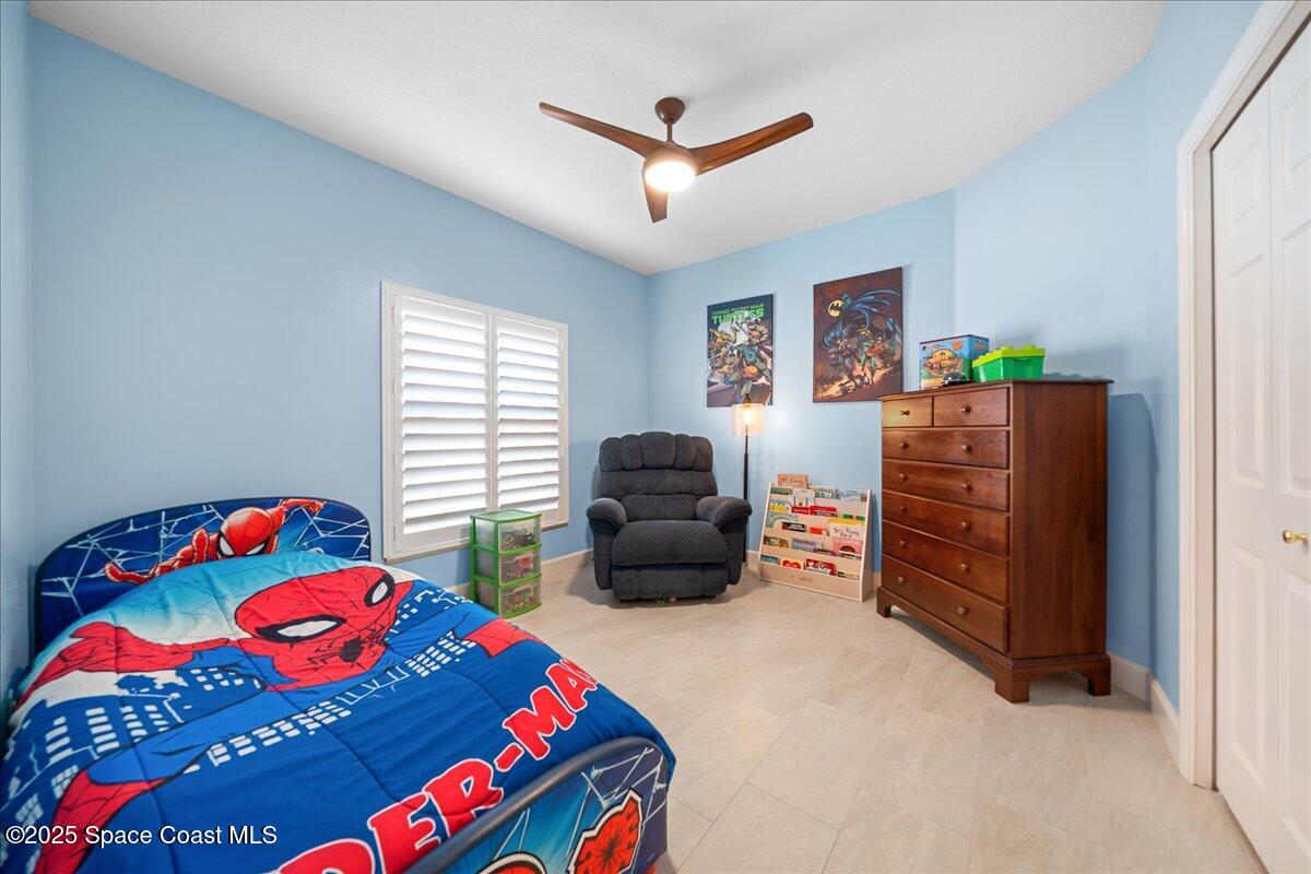 4329 Collingtree Drive Rockledge, FL 32955 - Photo 20 of 36 a bedroom with a bed and a window