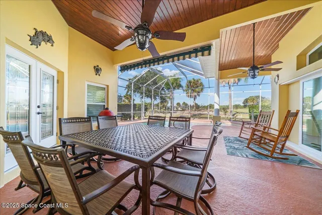 a view of a patio with a table and chairs