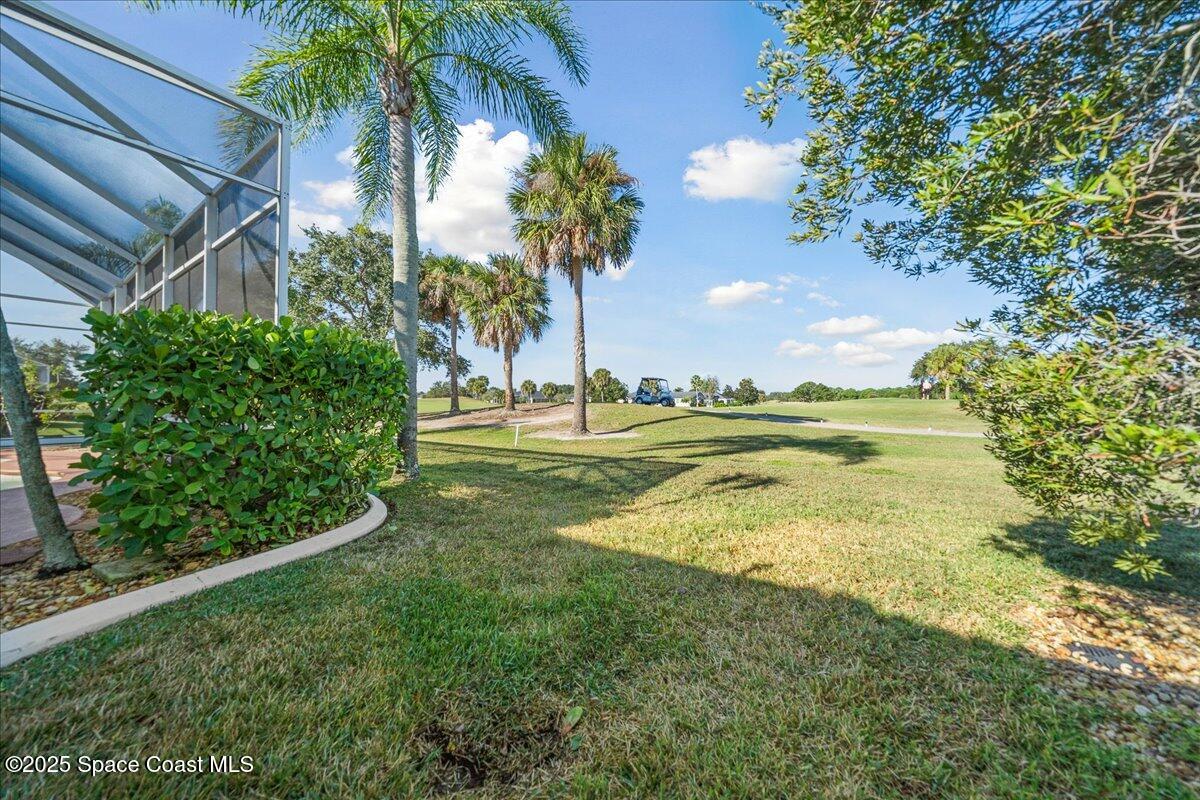 4329 Collingtree Drive Rockledge, FL 32955 - Photo 27 of 36 a view of a golf course with a garden