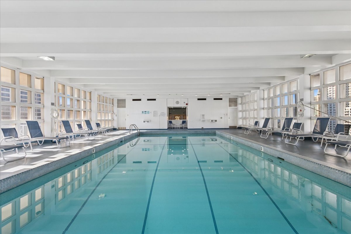 535 North Michigan Avenue, Unit 2204 Chicago, IL 60611 - Photo 16 of 26 a large white kitchen with lots of counter space and sink