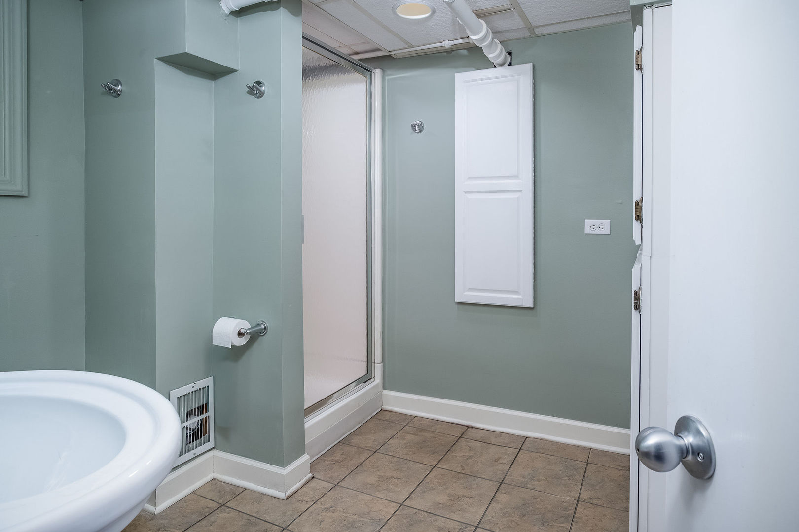 728 Howard Street Wheaton, IL 60187 - Photo 33 of 46 a bathroom with a tub and shower