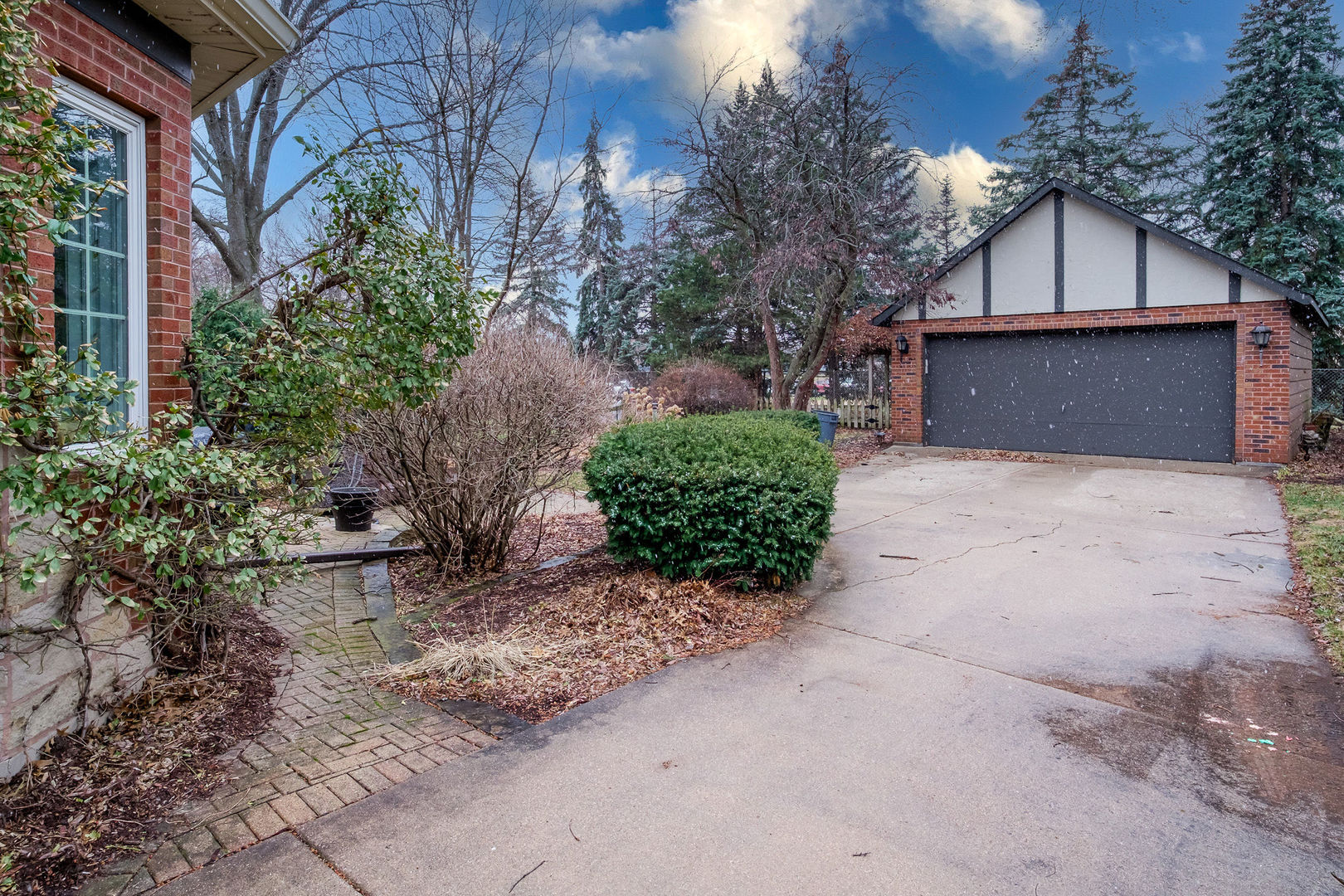 728 Howard Street Wheaton, IL 60187 - Photo 40 of 46 a front view of a house with a yard and garage