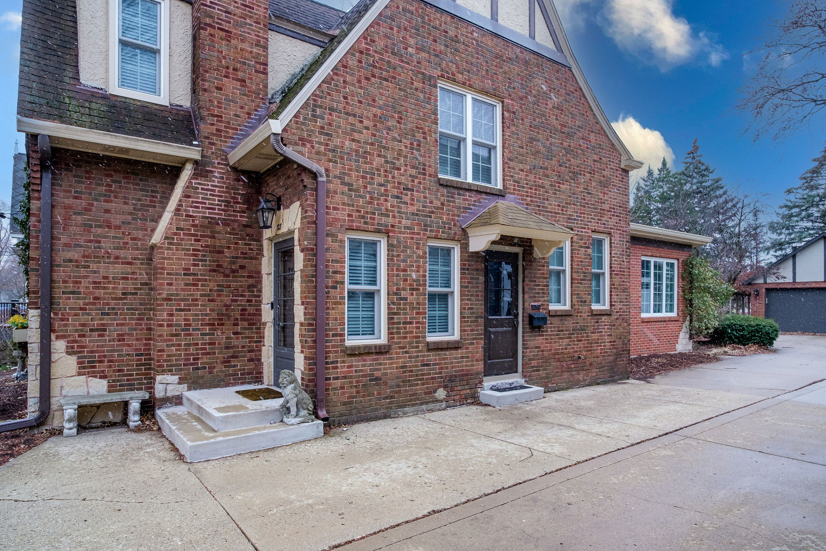 728 Howard Street Wheaton, IL 60187 - Photo 41 of 46 a brick building with a bench in front of it