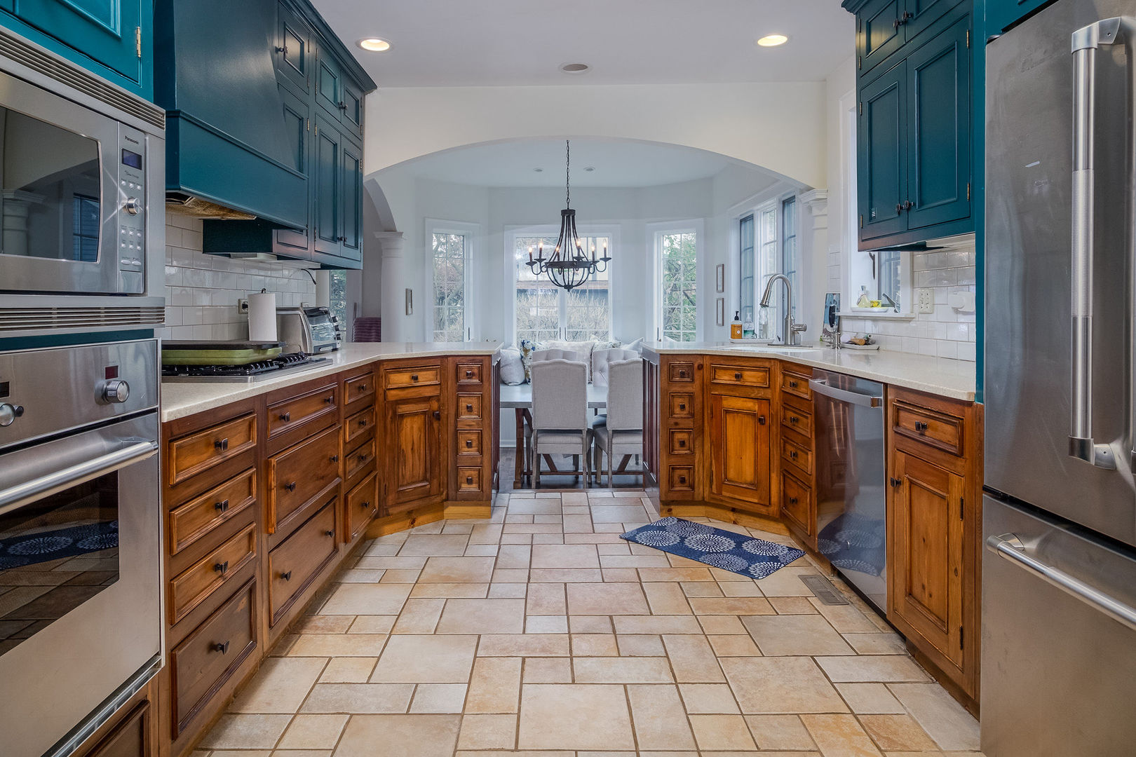 728 Howard Street Wheaton, IL 60187 - Photo 6 of 46 a large kitchen with stainless steel appliances granite countertop a stove and cabinets