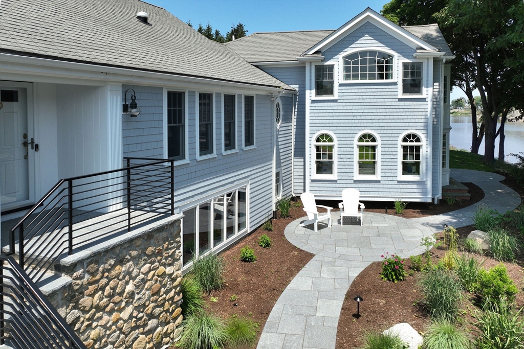 20 Nichols Road Cohasset, MA 02025 - Photo 42 of 42 a front view of a house with wooden fence