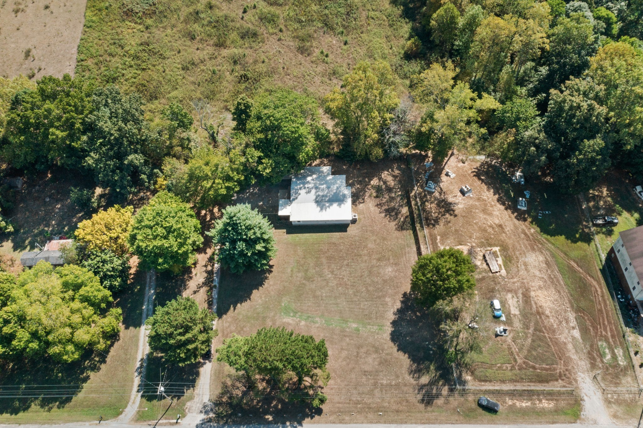 2306 Wayne Road Bon Aqua, TN 37025 - Photo 35 of 41 an aerial view of a house with a yard and garden