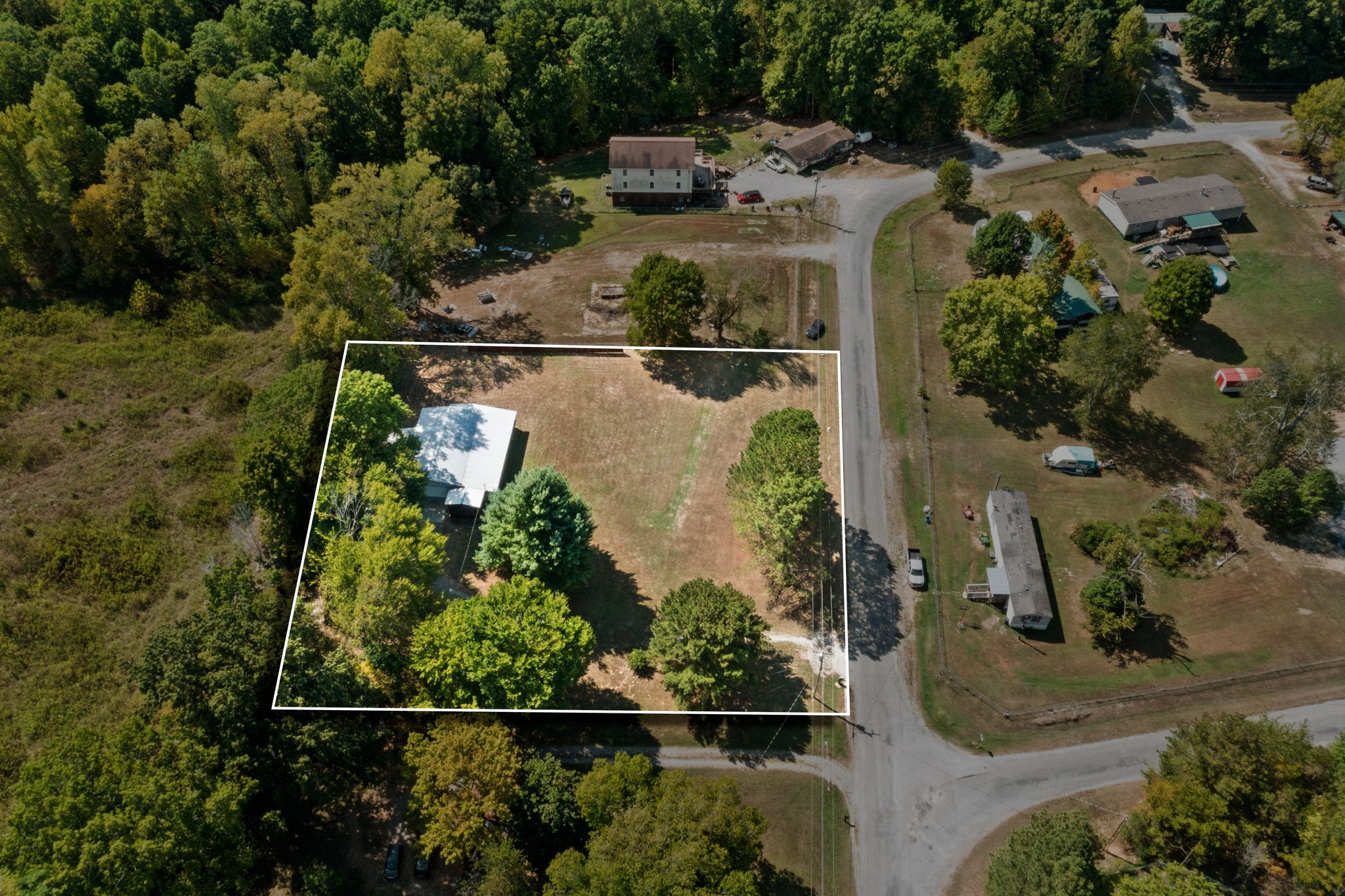 2306 Wayne Road Bon Aqua, TN 37025 - Photo 38 of 41 an aerial view of a house with a yard