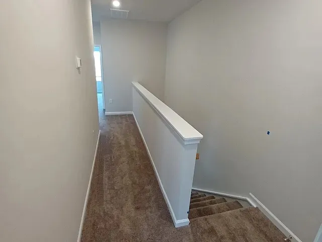 an empty room with a bathroom