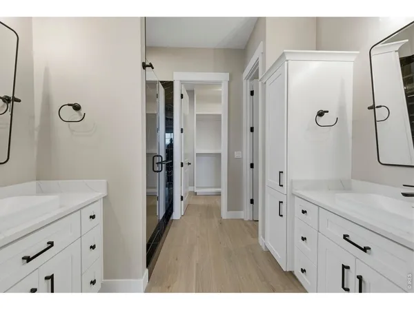 a bathroom with a sink vanity and mirror