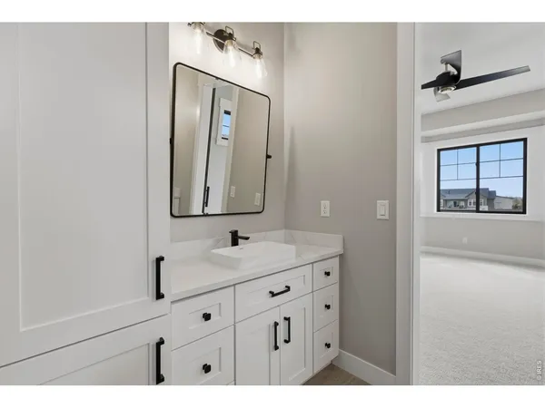 a bathroom with a shower and a sink