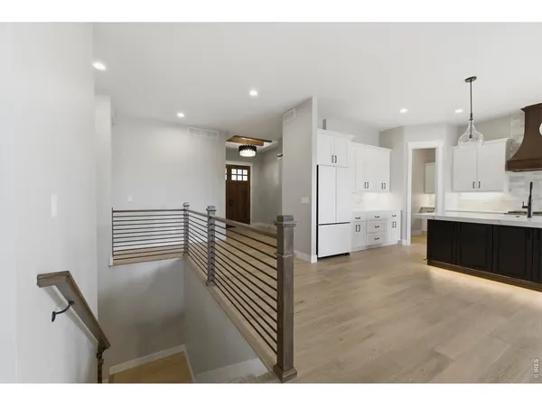 a view of a hallway with front door