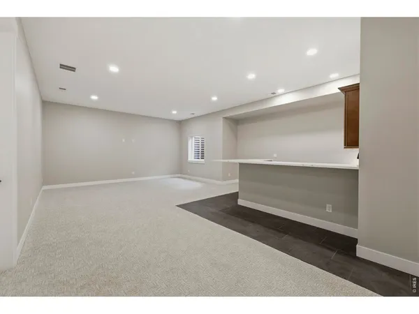 a view of kitchen with furniture and flat screen tv