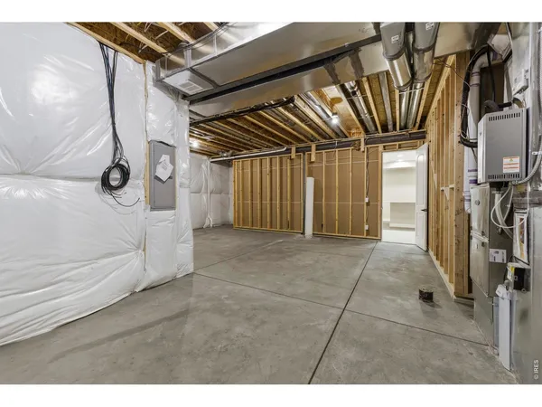 an empty room with a ceiling fan and glass door