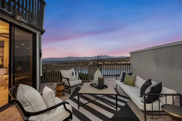 a view of a balcony with chairs