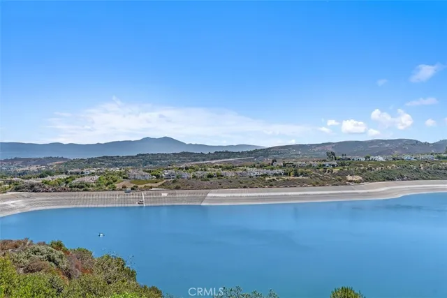 a view of an ocean and a mountain