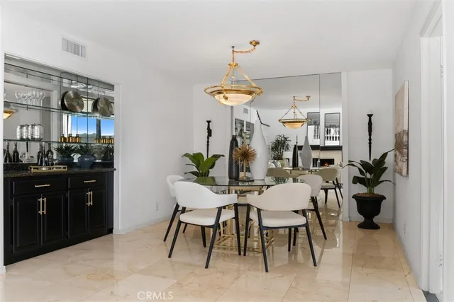 a dining room with a table and chairs