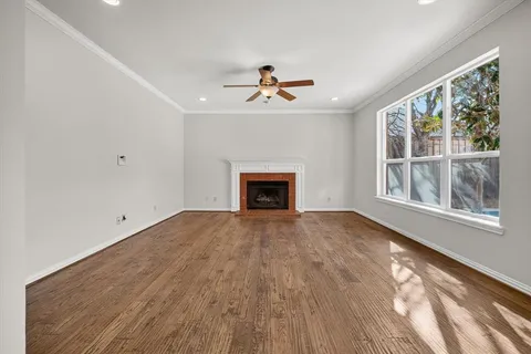 a kitchen with stainless steel appliances kitchen island granite countertop a stove top oven a sink and a refrigerator