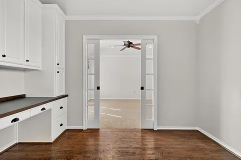 a view of empty room with ceiling fan