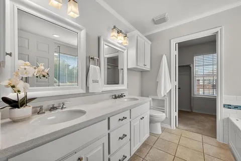 a view of a livingroom with a ceiling fan and window