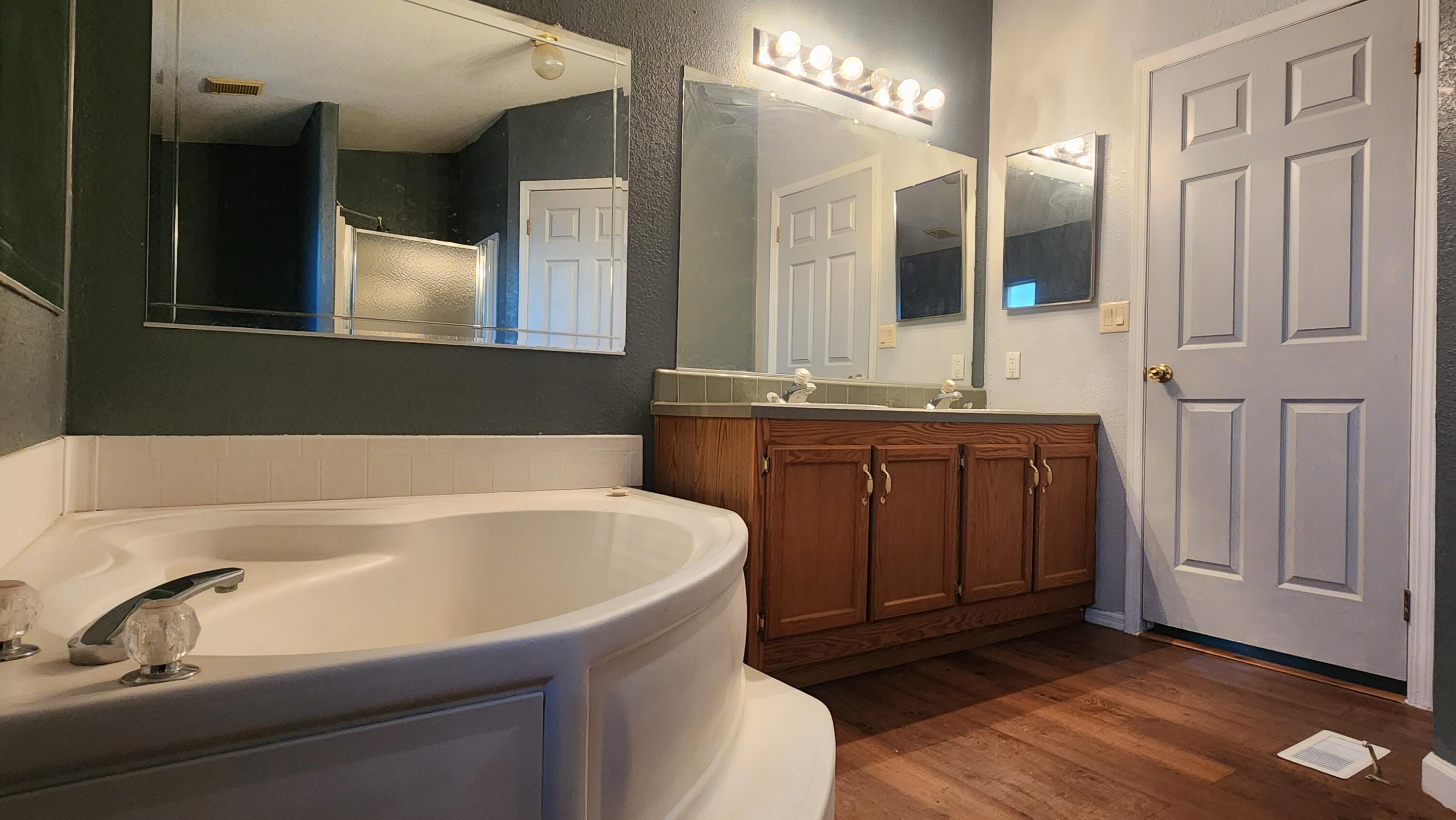 3641 Dawn Road Rosamond, CA 93560 - Photo 16 of 33 a bathroom with a bathtub and a sink